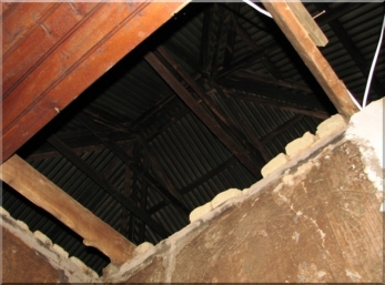 Looking up. Many of the rafters had been eaten by rats.