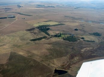From the air looking to the north west. Homestead is in the middle. D&T's pond and Aidan's pond just to the right of the homestead. Nicole's pond in the foreground. The dust road on the left is the South West boundary. The line running from the top left corner to the middle right is the Northern boundary.